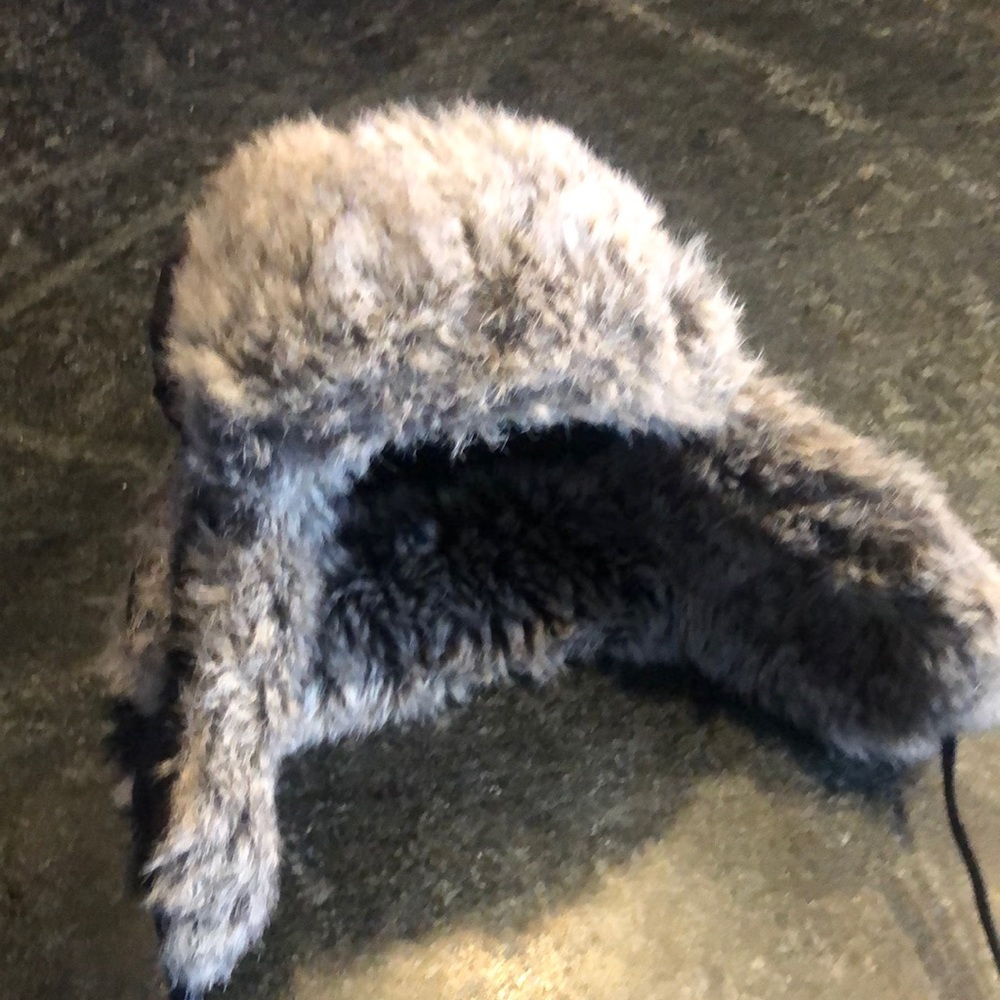 Faux fur hat with polyurethane coating.